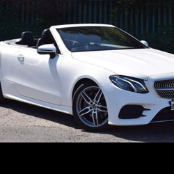 A white Mercedes convertible used as Graham's profile picture